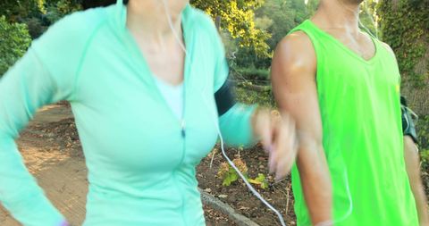 Active Couple Jogging Outdoors Enjoying Sunny Day