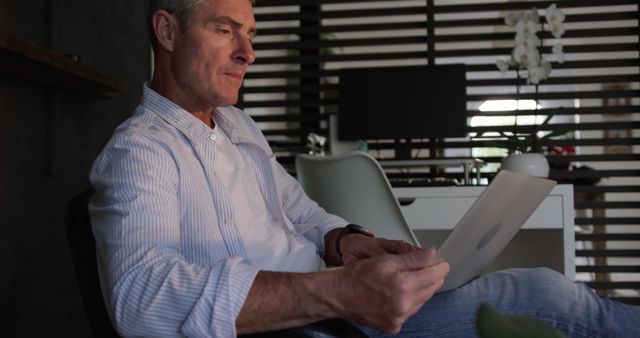 Older Man Using Tablet in Modern Home Office - Download Free Stock Images Pikwizard.com