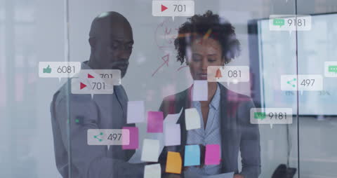 Business Team Analyzing Digital Engagement with Social Media Icons