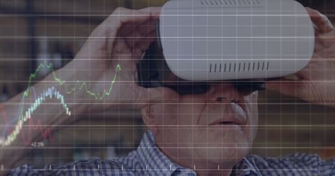 Senior Businessman Engaging with Financial Analytics via VR