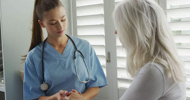 Healthcare Professional Checking Patient's Hands During Medical Consultation - Download Free Stock Images Pikwizard.com