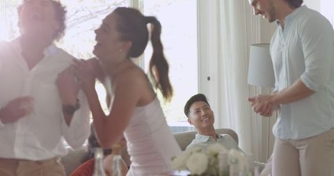 Joyful Family Celebration at Home with Laughter and Togetherness