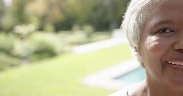 Smiling Senior Woman in Garden, Close-Up - Download Free Stock Images Pikwizard.com