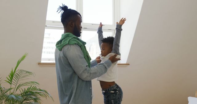 Father playing with child in bright apartment, bonding and happiness - Download Free Stock Images Pikwizard.com