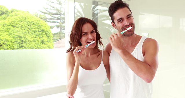 Healthy Smiling Couple Brushing Teeth in Bright Modern Bathroom - Download Free Stock Images Pikwizard.com