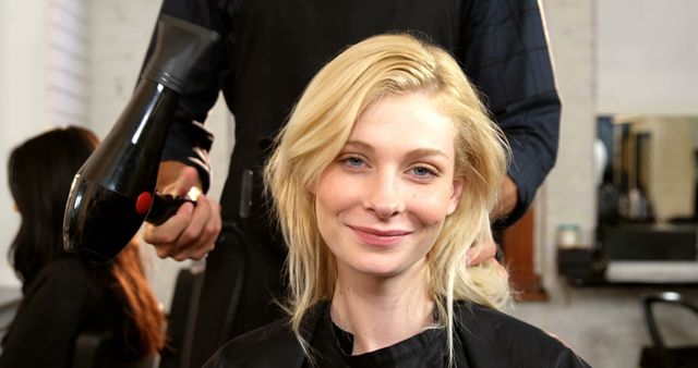 Blonde Woman Smiling While Getting Hair Styled at Salon - Download Free Stock Images Pikwizard.com