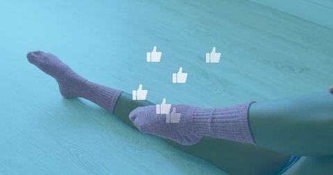 Vibrant thumbs up icons over cozy socks