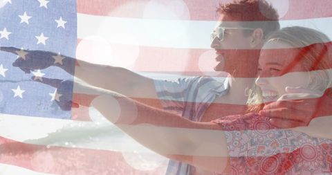 Couple on Beach with American Flag Overlay Demonstrates Patriotism