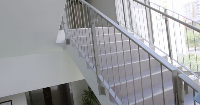 Modern White Staircase with Metal Handrails in Sunlit Interior - Download Free Stock Images Pikwizard.com