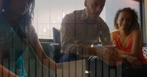 Business team collaborating with digital data graphs