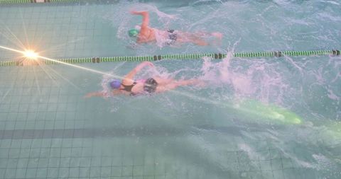 Competitive Swimmers Training in Pool