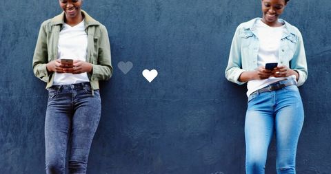 Young Women Engaging with Smartphones on Social Media Platforms