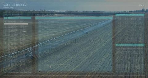 Digital data overlay on irrigated crop field in rural landscape