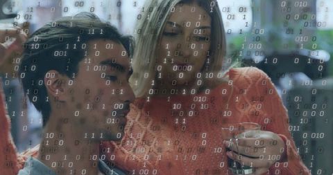 Couple Relaxing with Digital Transparency Overlay in Modern Cafe