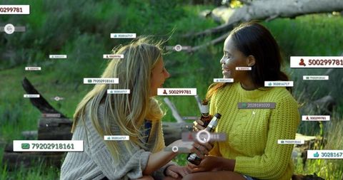 Friends chatting outdoors amid ar overlays holding beer bottles at golden hour