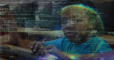 Young Student Engaged with Computer Programming at School