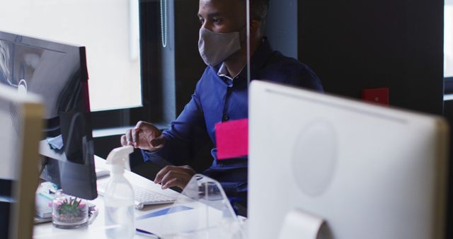 Office Worker Wearing Mask Using Computer - Download Free Stock Images Pikwizard.com