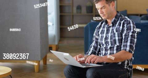 Businessman Using Laptop with Holographic Data Analysis