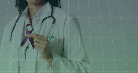 Healthcare professional holding purple ribbon for awareness