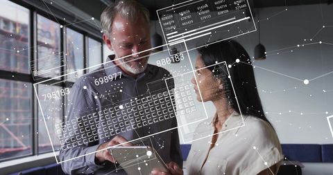 Diverse professionals collaborating on digital data interface