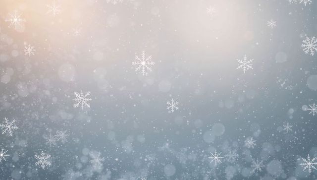 Drifting snowflakes with soft bokeh and warm upper-left glow, dreamy winter backdrop