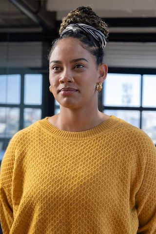 Confident urban professional woman in modern office environment