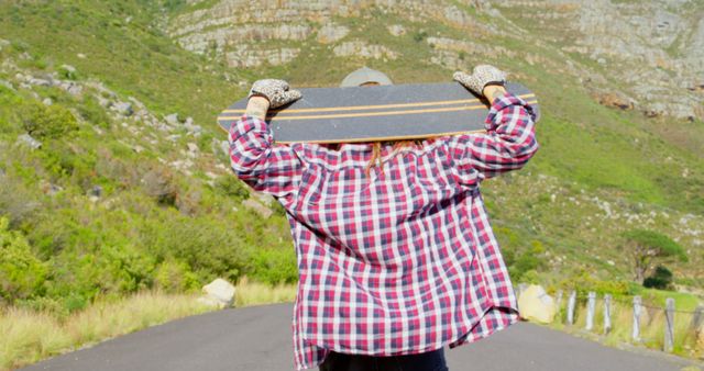 Woman Carrying Longboard Outdoors on Sunny Day - Download Free Stock Images Pikwizard.com