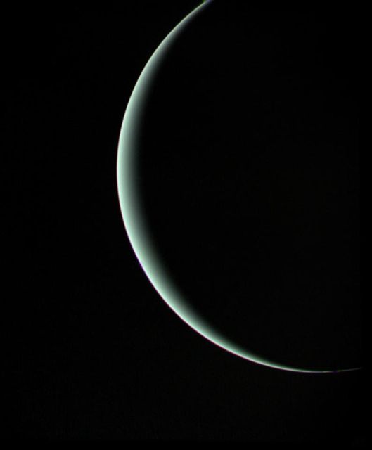 This view of pale blue-green Uranus was recorded by NASA's Voyager 2 on Jan 25, 1986, as the spacecraft left the planet behind. The thin crescent of Uranus is seen here between the spacecraft, the planet and the Sun.  http://photojournal.jpl.nasa.gov/catalog/PIA00143