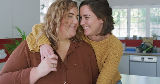 Portrait of caucasian lesbian couple embracing and smiling - Download Free Stock Photos Pikwizard.com