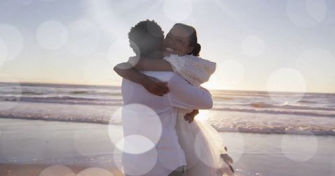 Joyful Bride and Groom Embrace on Scenic Beach Wedding