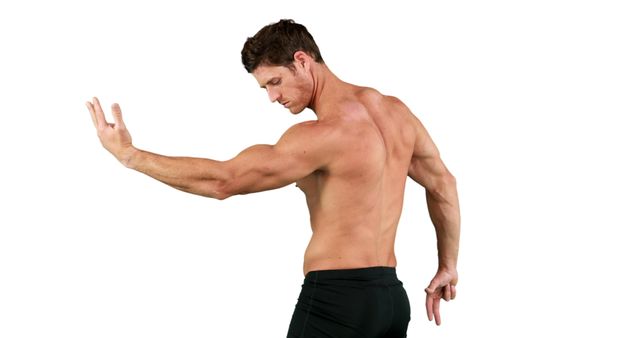 A young Caucasian male showcases his muscular physique and strength, with copy space. His pose emphasizes his toned biceps and triceps, highlighting a focus on fitness and bodybuilding.