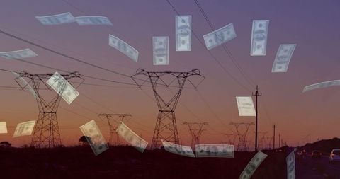 Dollar bills falling over electrical power lines at dusk