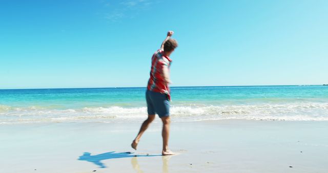 Excited man dancing on the beach 4k