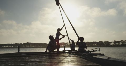 Young Women Preparing Sailboat at Sunset on Dock - Download Free Stock Images Pikwizard.com