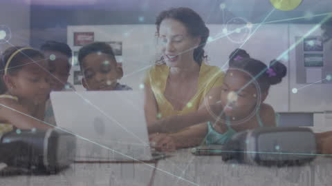 Teacher Engaging with Students in Technology-Driven Classroom