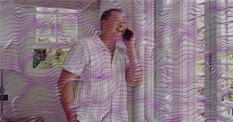 Man talking on smartphone by curtain window with purple wave overlay, home interior portrait
