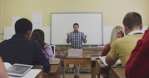 Teacher Leading Class with Diverse Students Using Technology - Download Free Stock Images Pikwizard.com