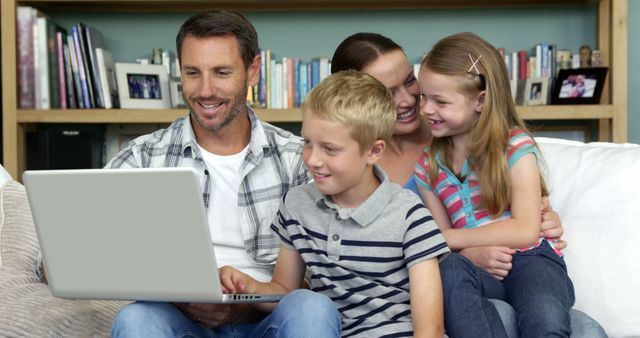 Happy Family Using Laptop at Home Together - Download Free Stock Images Pikwizard.com