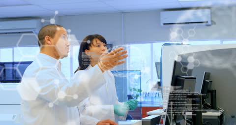 Scientists Analyzing Data on Computer with Digital Overlays