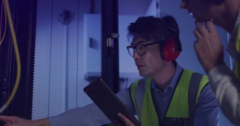 Technicians Monitoring Data Center Hardware Processes