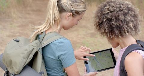 female friends using tablet for hiking navigation - Download Free Stock Images Pikwizard.com