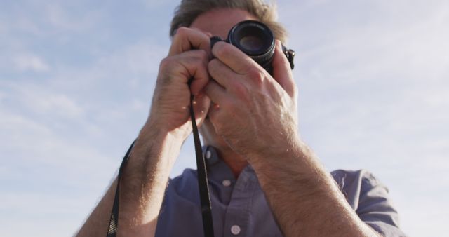 Photographer Capturing Landscape with Camera on Clear Day - Download Free Stock Images Pikwizard.com