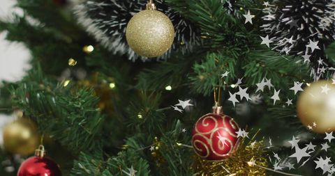 Festive Christmas Tree with Glittering Ornaments and Sparkling Stars