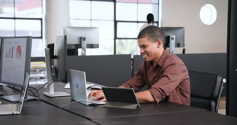 Happy business professional working passionate in modern office