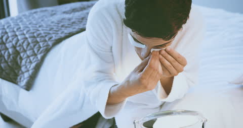 Man Applying Under Eye Masks for Relaxing Wellness Routine