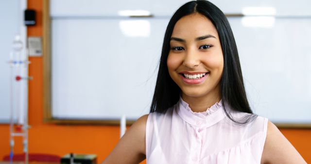 Confident Female Student in Classroom Smiling - Download Free Stock Images Pikwizard.com