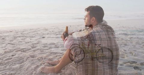 Contemplation at Sunset; Man Enjoying Beach with Bicycle Layered View