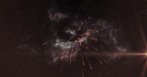 Vibrant fireworks exploding against a starry night sky