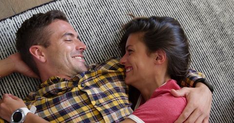 Happy Caucasian Couple Embracing at Home Radiating Joy