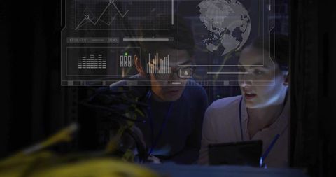 It technicians monitoring server rack with holographic data display and tablet